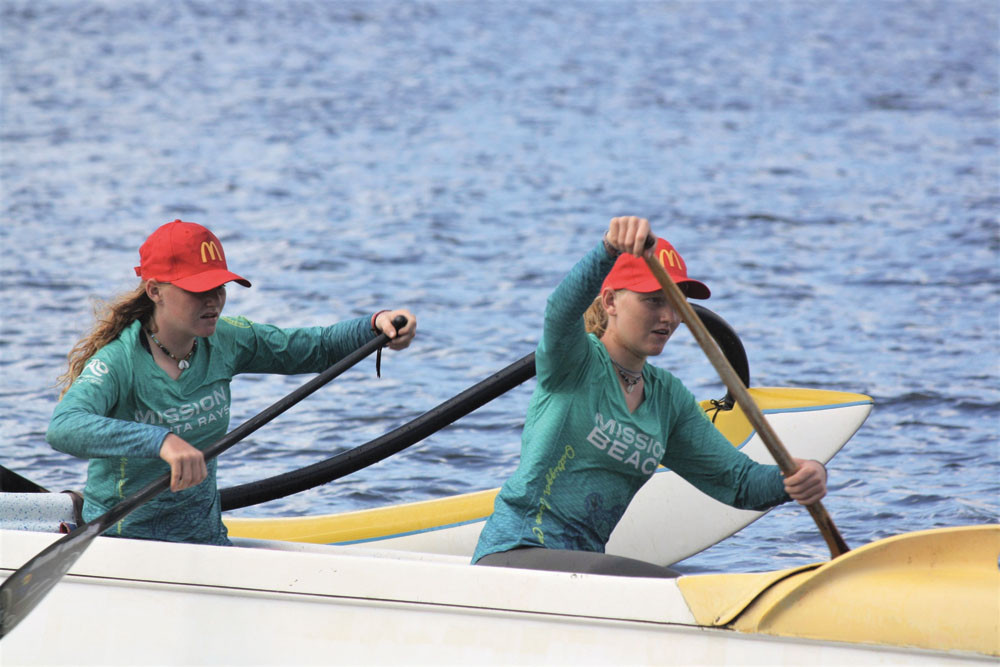 Mission Beach under-19s outrigger canoe paddlers Azariah and Eliana Wigley-Gill in action in the Coral Sea. Picture: Supplied